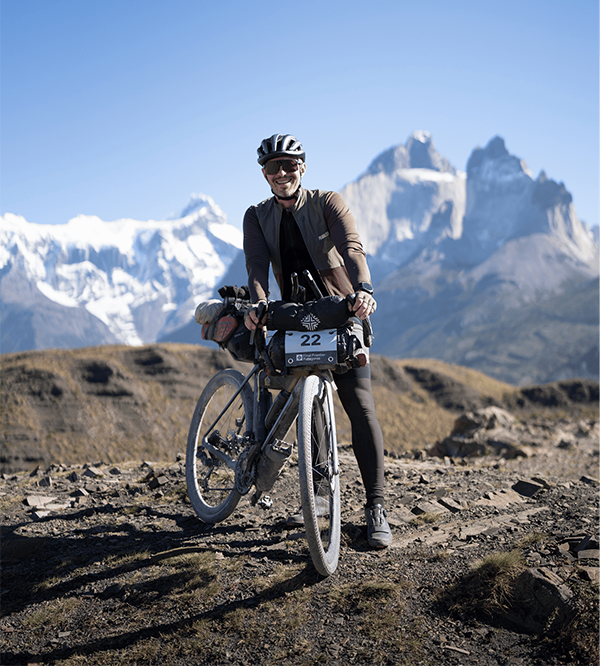 Cyclist with Patagonia mountains